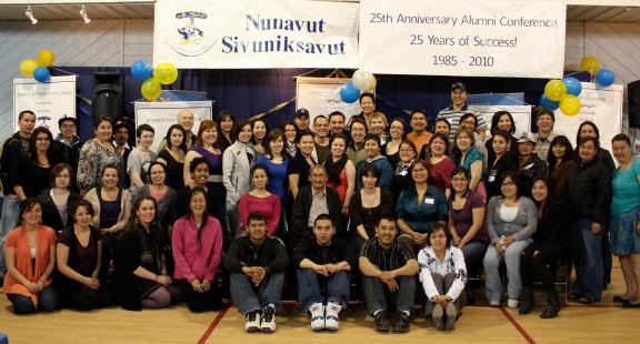 John Amagoalik surrounded by dozens of students